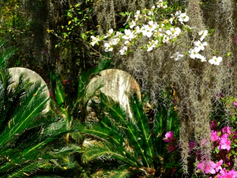 Headstones nestled among lush vegetation